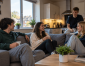 Students relaxing together in a modern shared student house in Ormskirk